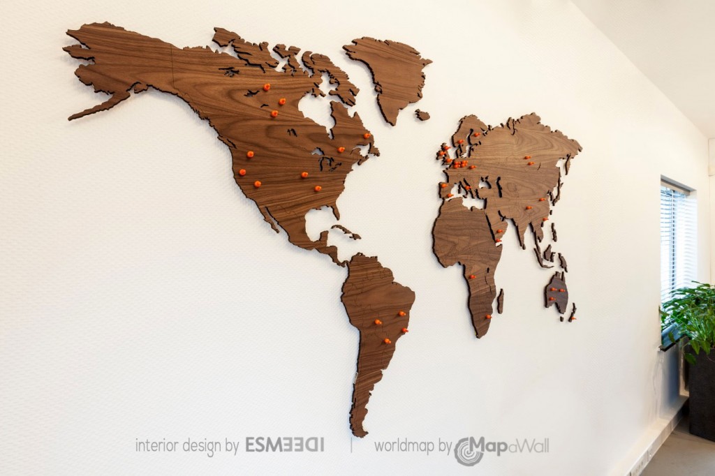 Wooden magnetic world map Walnut in office - sideview