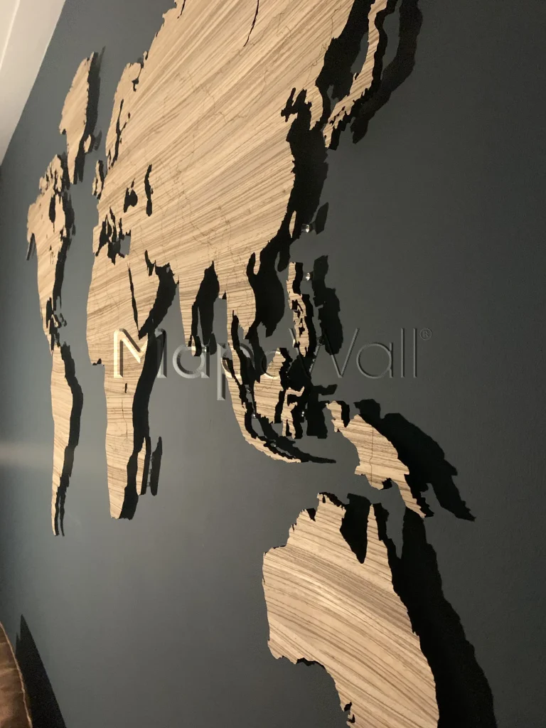 Close up photo of the Zebrano world map with shadow from lights