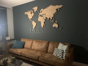 The Zebrano wooden world map installed on a black wall in a modern interior