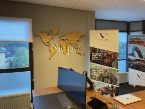 A magnetic wooden world map installed in a CEO's office