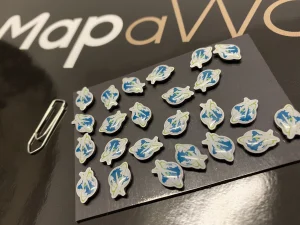 Epoxy pins with aviation company logo for magnetic world map