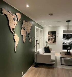 The Zebrano world map installed on a green wall - side view